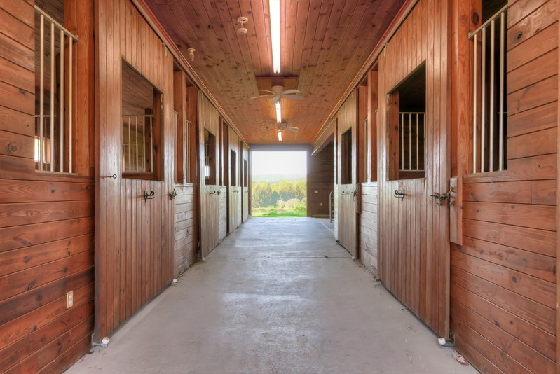 A 6-stall barn also includes ample hayloft space above. Learn more at NewJerseyLuxuryAuction.com.