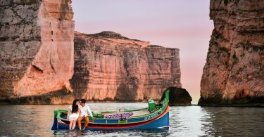 Couple in a Maltese Luzzu - image courtesy of Malta Tourism Authority